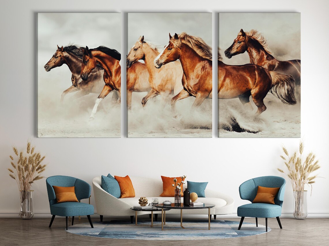 Realistic image of four galloping horses with flowing manes across sandy ground and a hazy pale background detail view