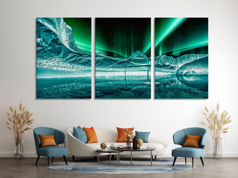 Three-panel aurora borealis scene with teal-green light over icy mountains and dark reflective water