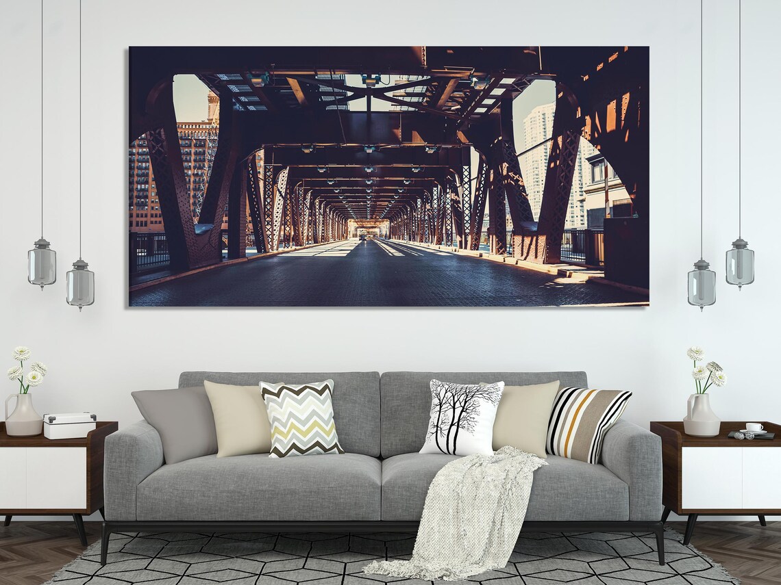 Multi-panel photo of an industrial steel bridge walkway with repeating beams and warm light, viewed in perspective detail view