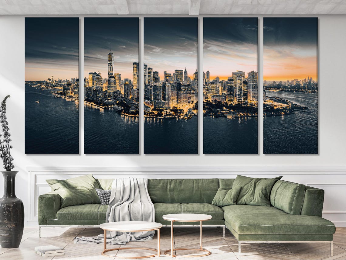 Room mockup showing a Manhattan skyline at dusk artwork above a sofa