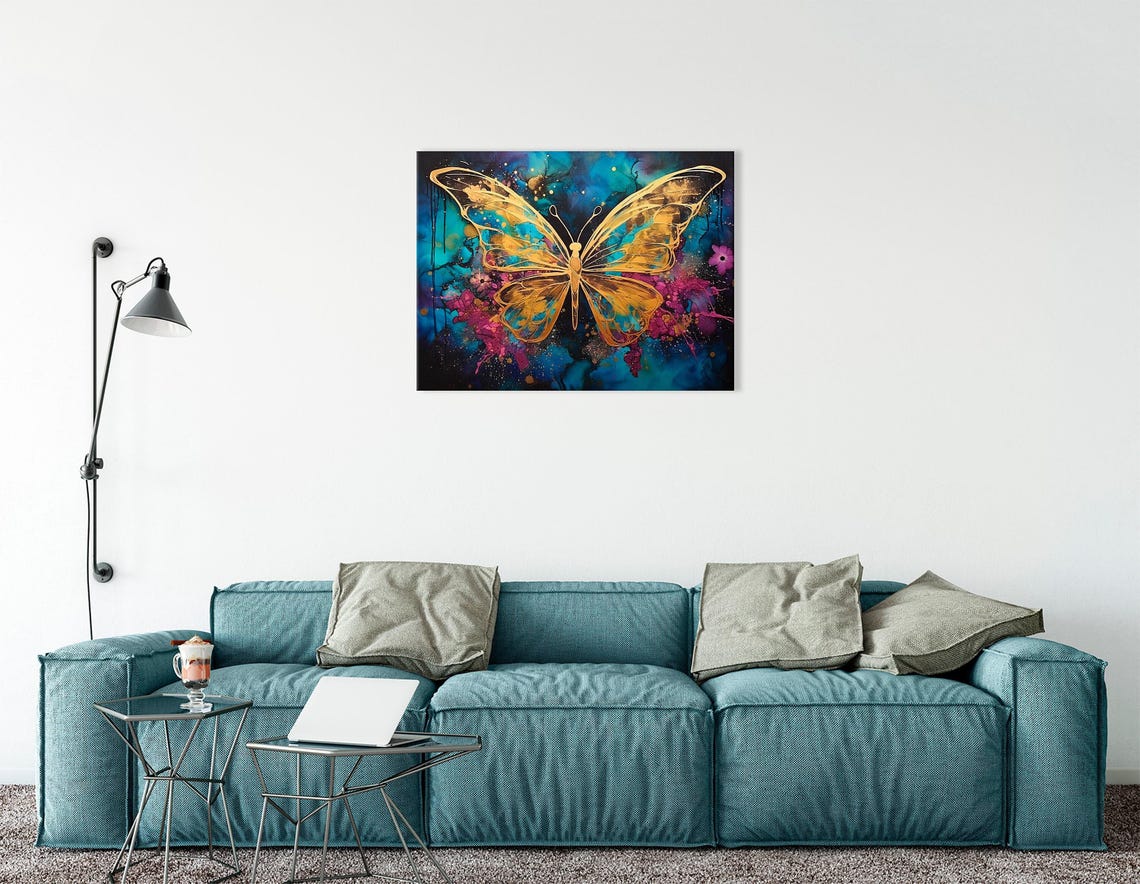 Abstract gold butterfly on a teal, blue and magenta splash background with glitter-like speckles detail view