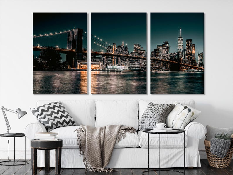 Three-panel night cityscape with an illuminated bridge, glowing skyline and reflections on dark water