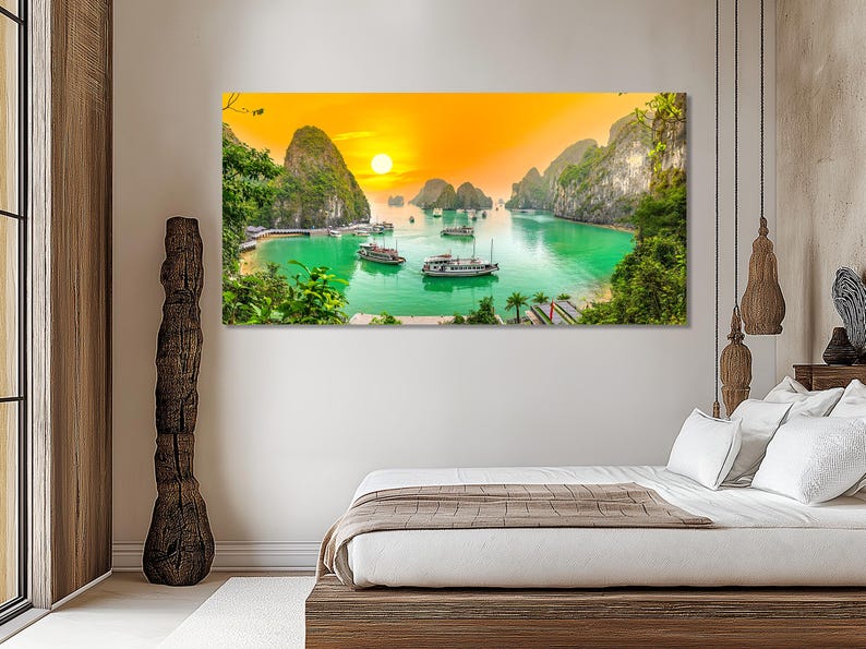 Sunset ocean bay with glowing sun, green-blue water, boats, cliffs and leafy greenery