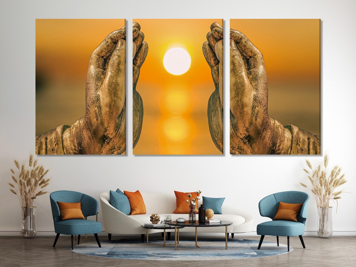 Golden Buddha hands praying with a glowing sun on warm orange sunset background in a multi-panel artwork detail view