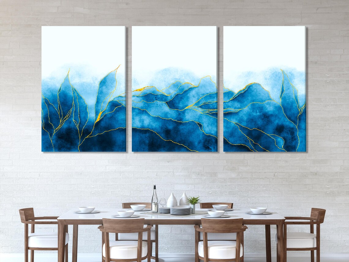 A five-panel blue abstract artwork shows flowing wave-like forms with delicate gold linework over watercolour-style blue washes detail view