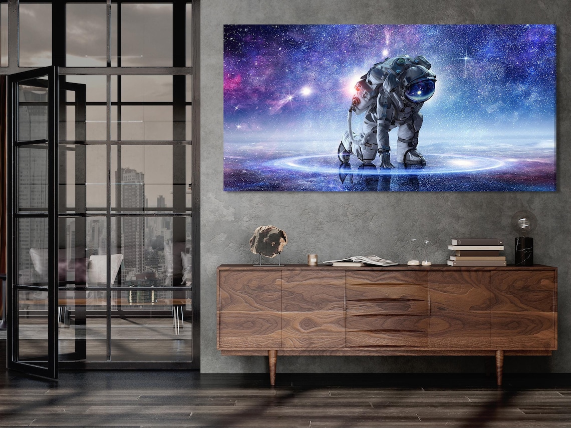 Three-panel space artwork with an astronaut standing in a starry galaxy with glowing purple-blue horizon detail view