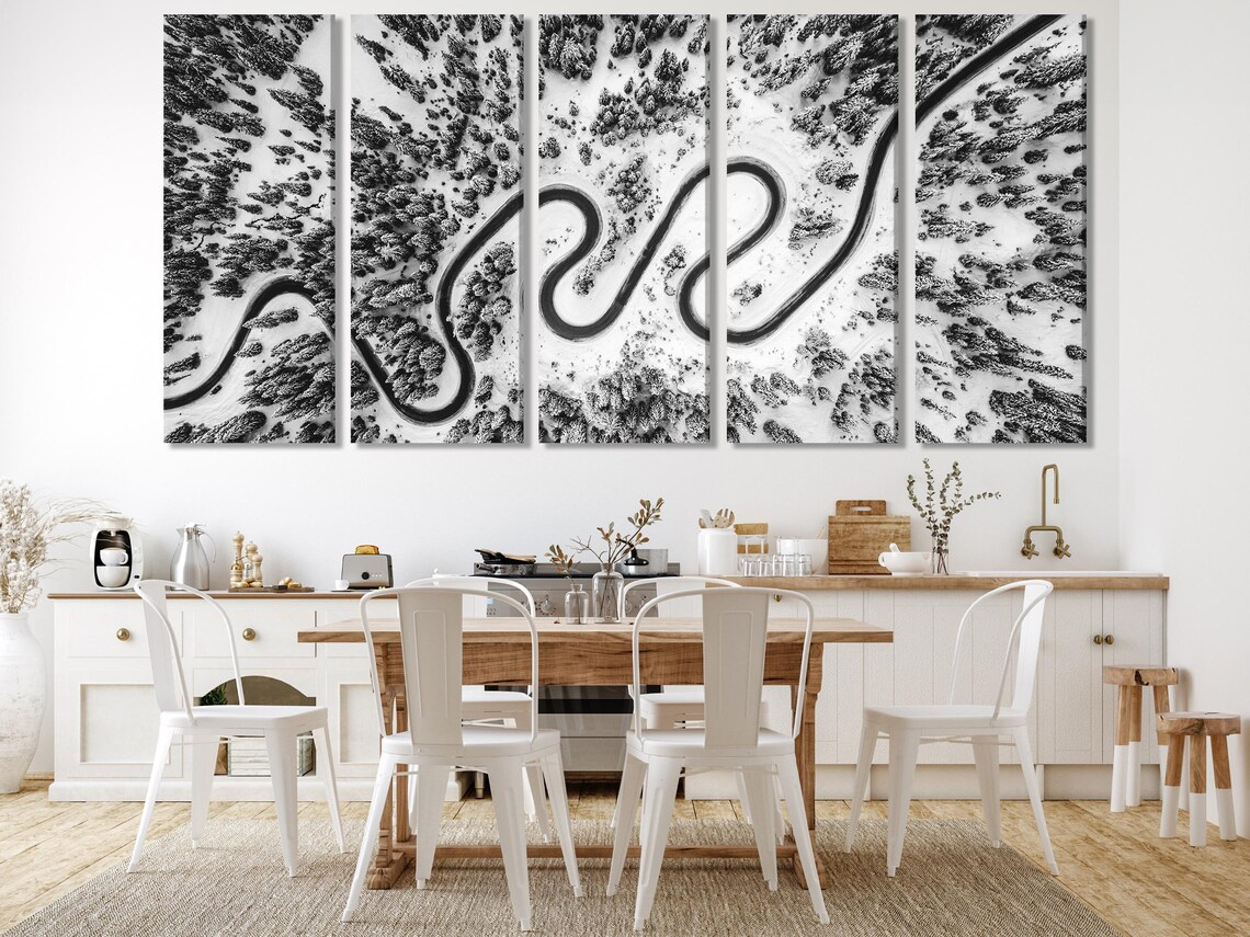 Three black-and-white aerial panels showing winding snowy roads through a forest detail view