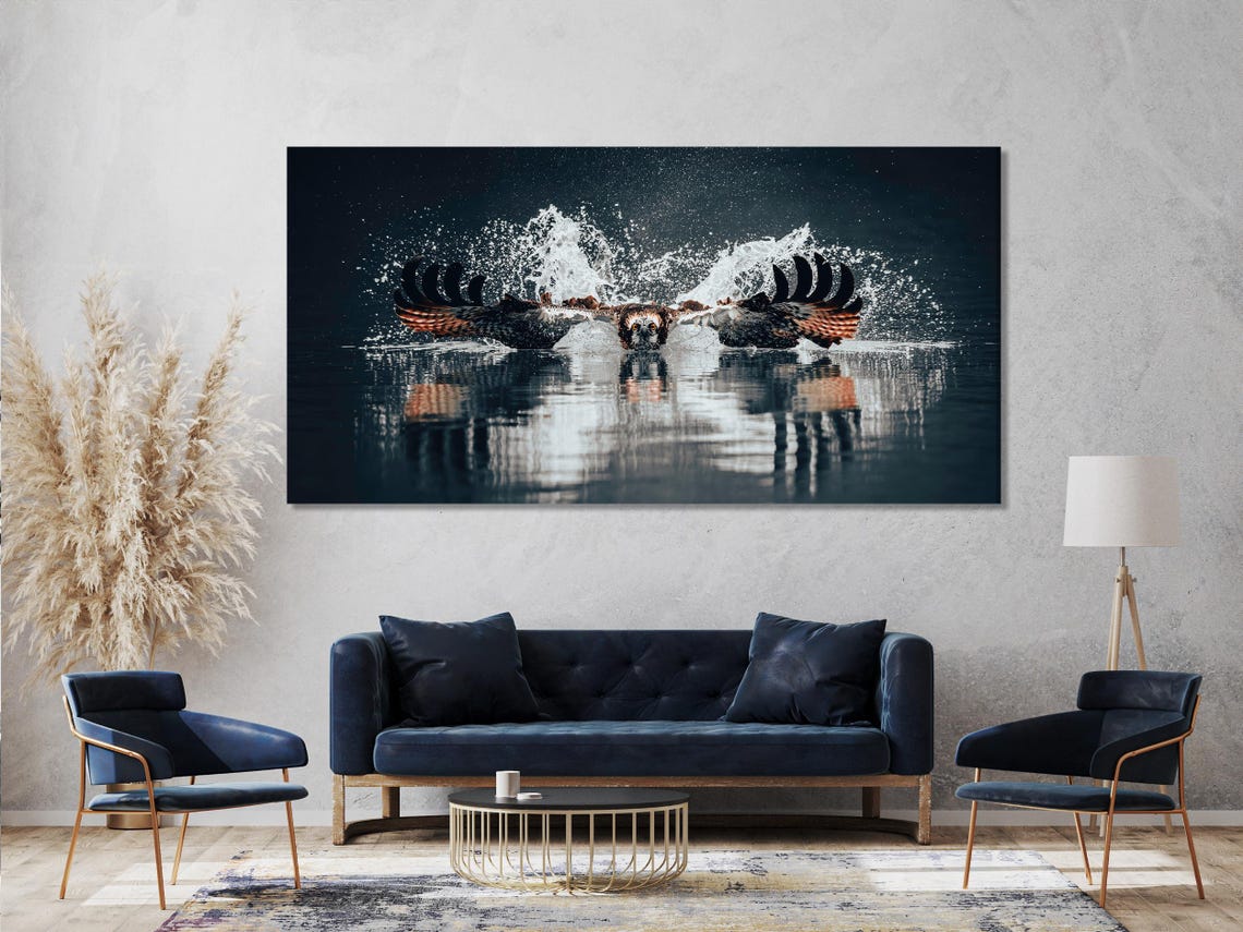 Room mockup with a white sofa and a three-panel osprey diving wildlife artwork above