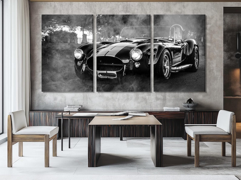 Black-and-white classic sports car across three vertical panels with misty outdoor background and bright headlights