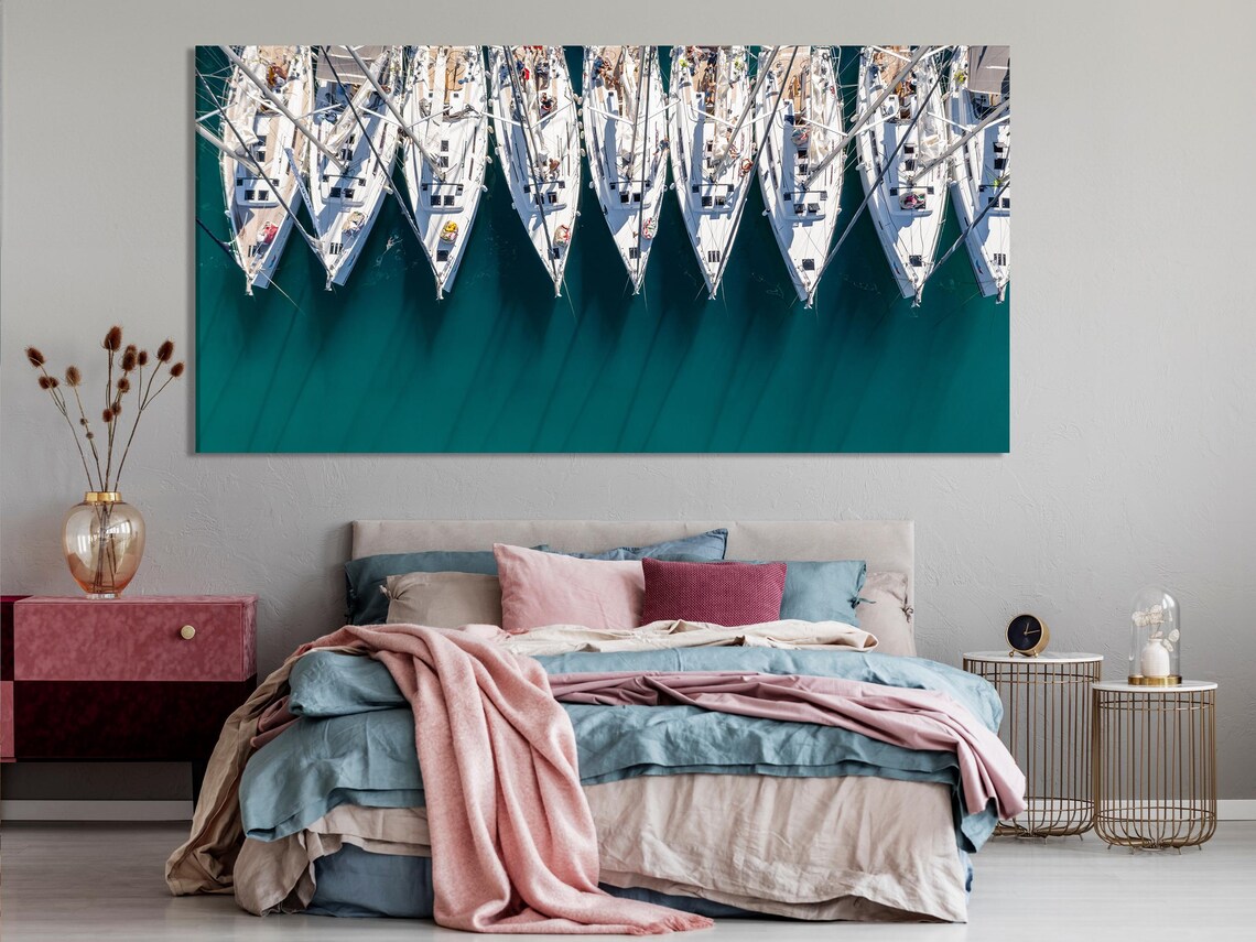 Dining room mockup with teal marina aerial sailboat artwork on the wall