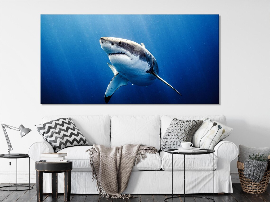 Realistic great white shark swimming through deep blue underwater water detail view