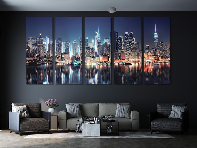 Night city skyline with illuminated skyscrapers and tower lights reflected on dark water
