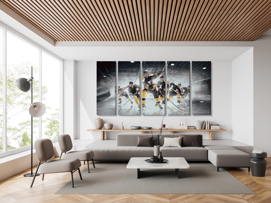 Living room mockup with blue sofa and a large ice hockey artwork above it
