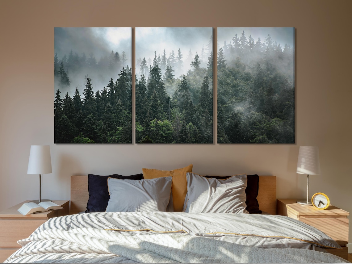 Room mockup showing a misty forest artwork above a sideboard with plants and seating