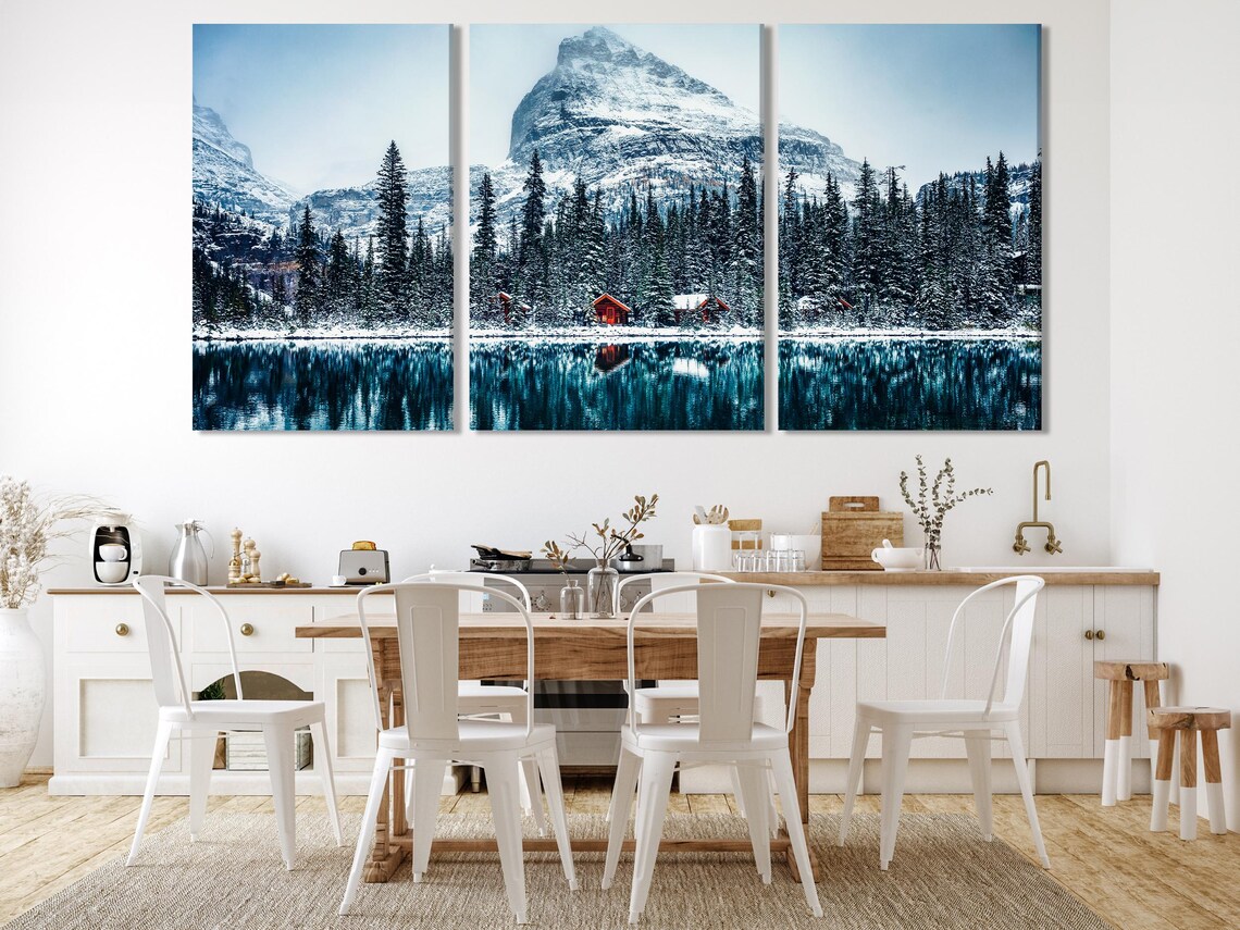 Room mockup showing snowy mountain panel artwork above a sofa