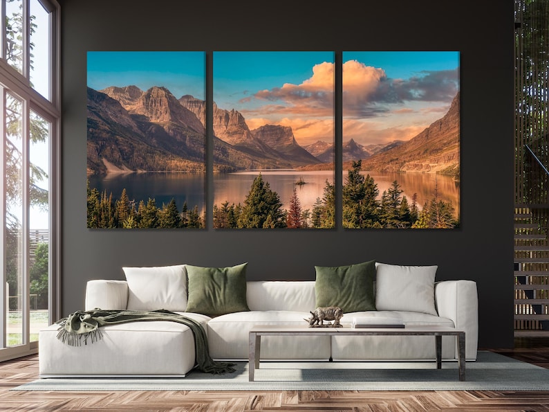 Three-panel landscape artwork with mountains, evergreen trees, calm lake reflections and a sunset sky