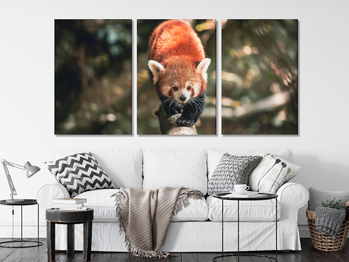 Room mockup showing a framed red panda artwork above a sofa