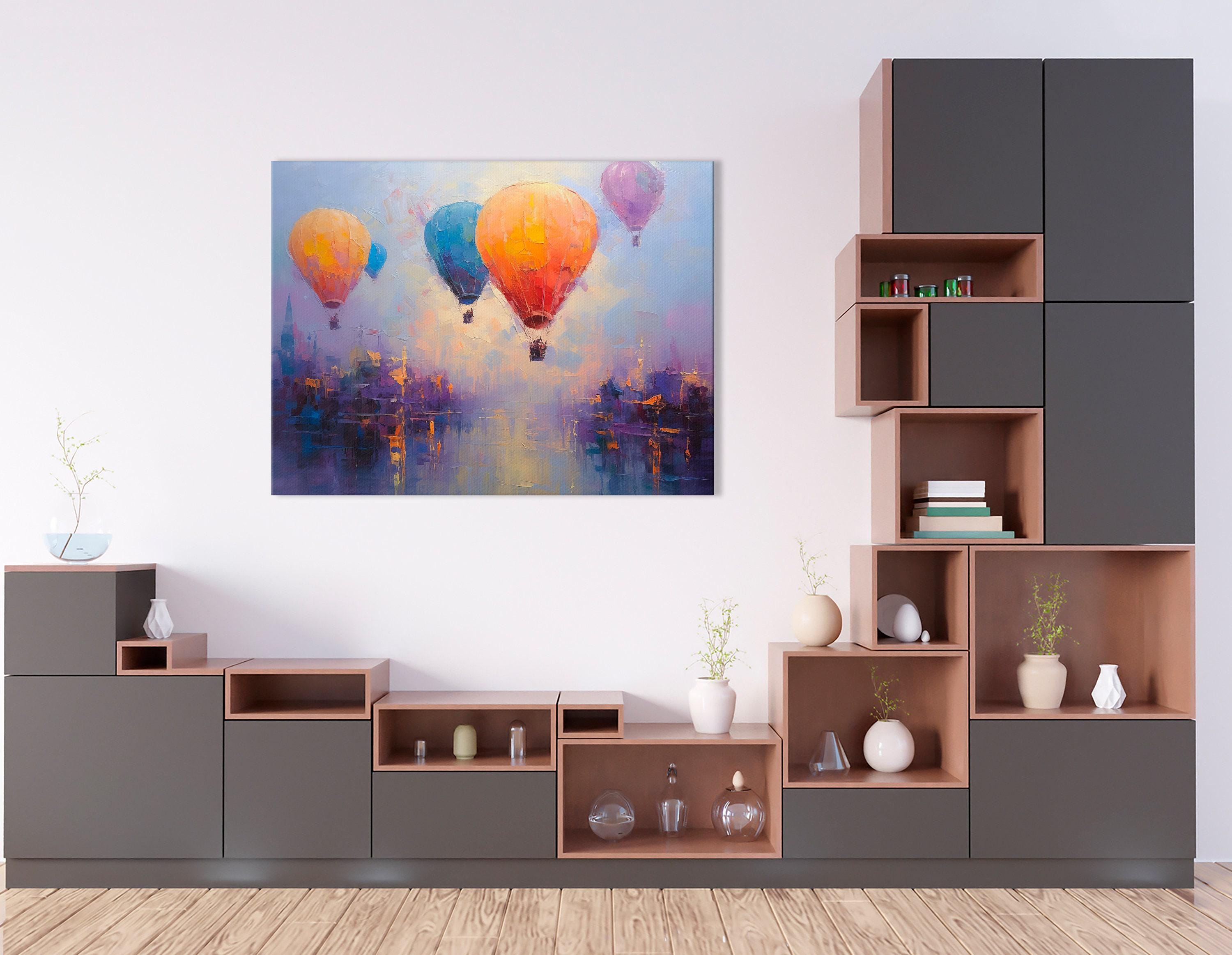 Three colourful hot air balloons floating above a stylised city at sunset detail view
