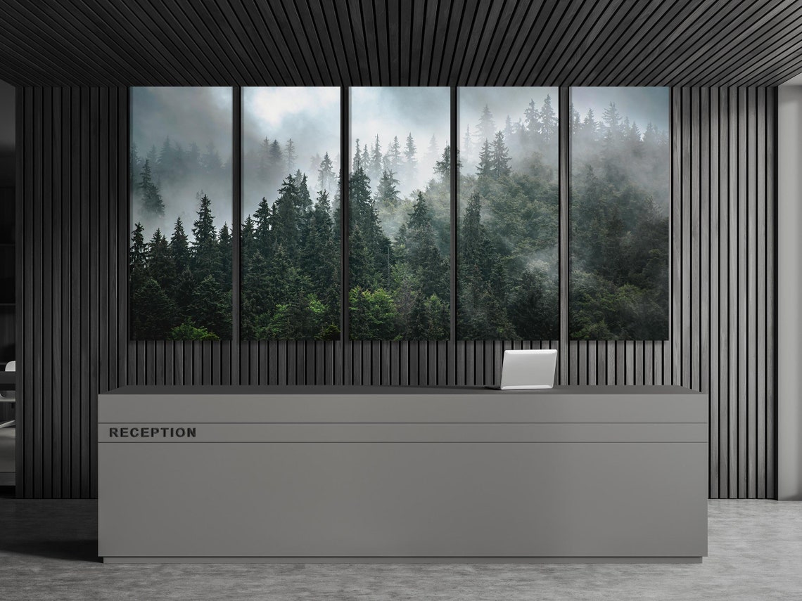 Room mockup showing a misty forest artwork above a sideboard with plants and seating