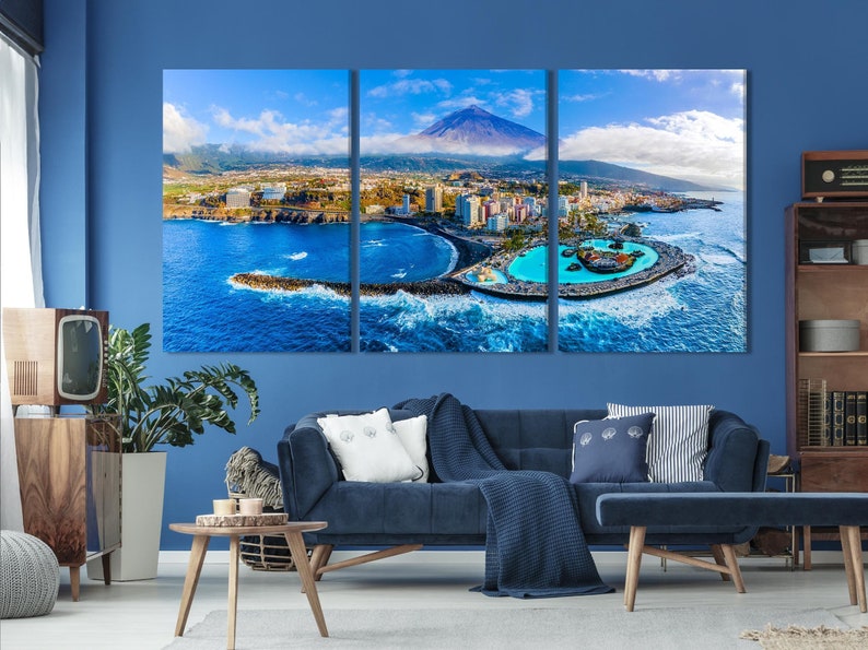 Three-panel aerial coastline with turquoise bay, blue ocean waves, coastal town and volcanic mountain