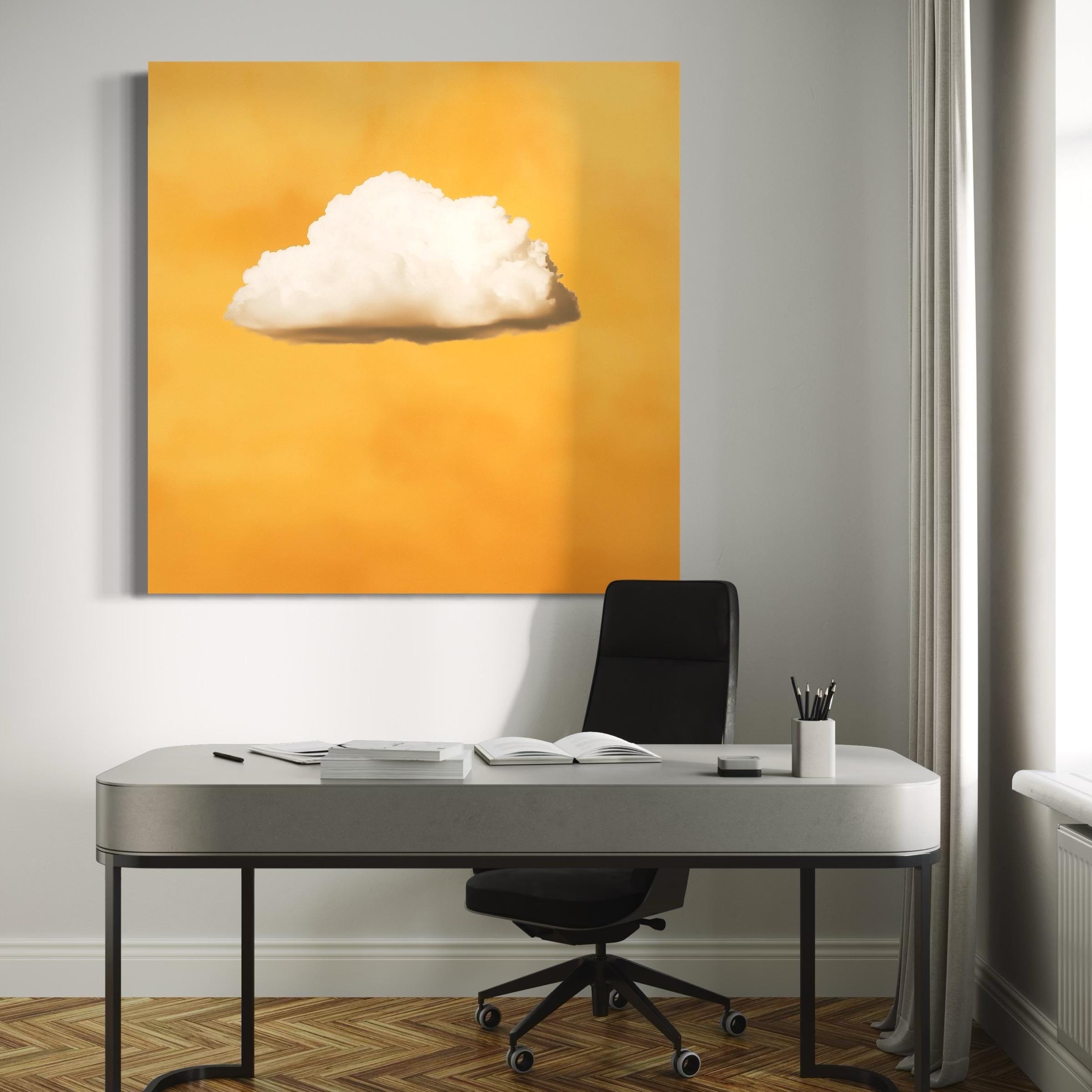 White cloud artwork hanging above a sofa with pillows in a bright room
