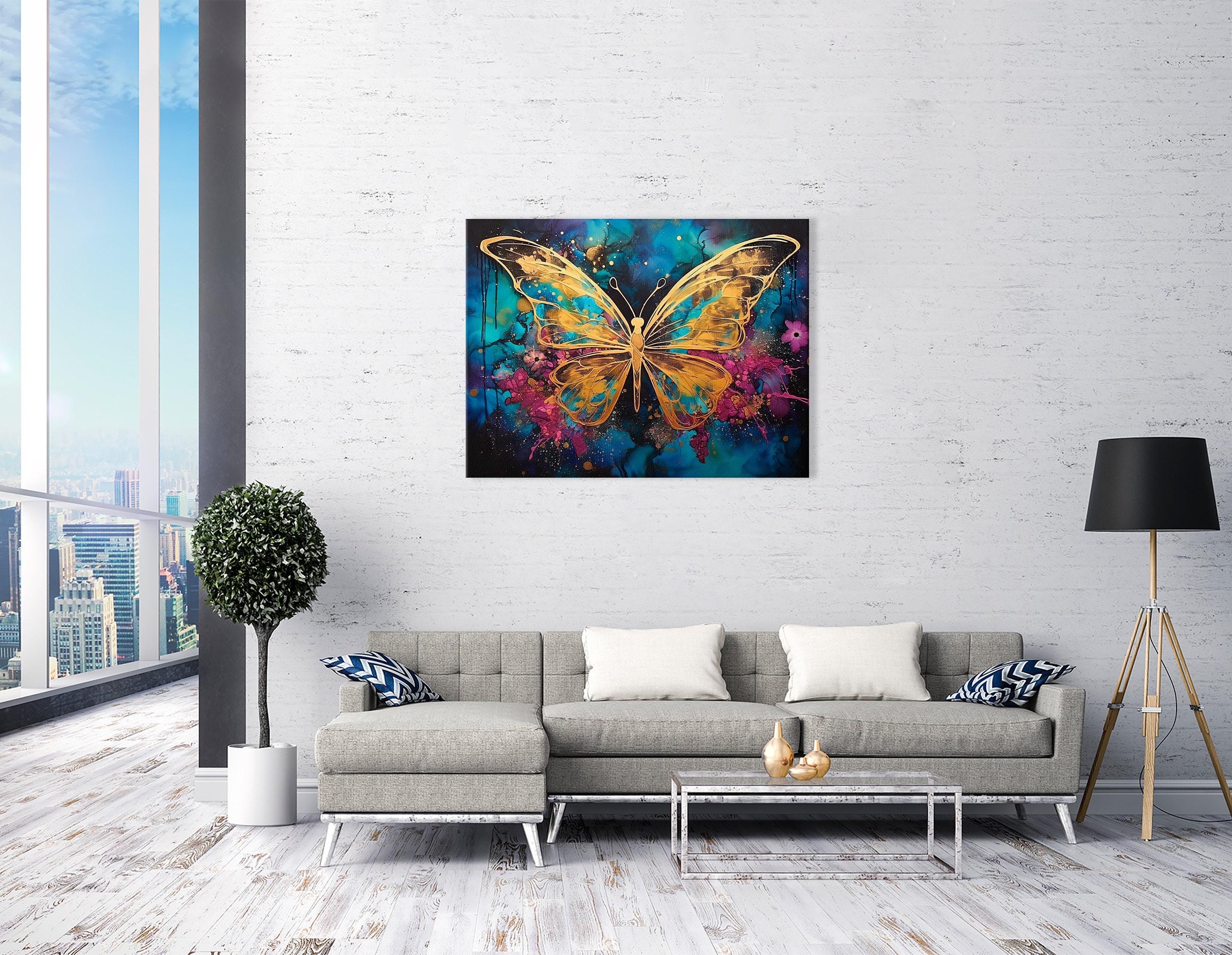 Abstract gold butterfly on a teal, blue and magenta splash background with glitter-like speckles detail view
