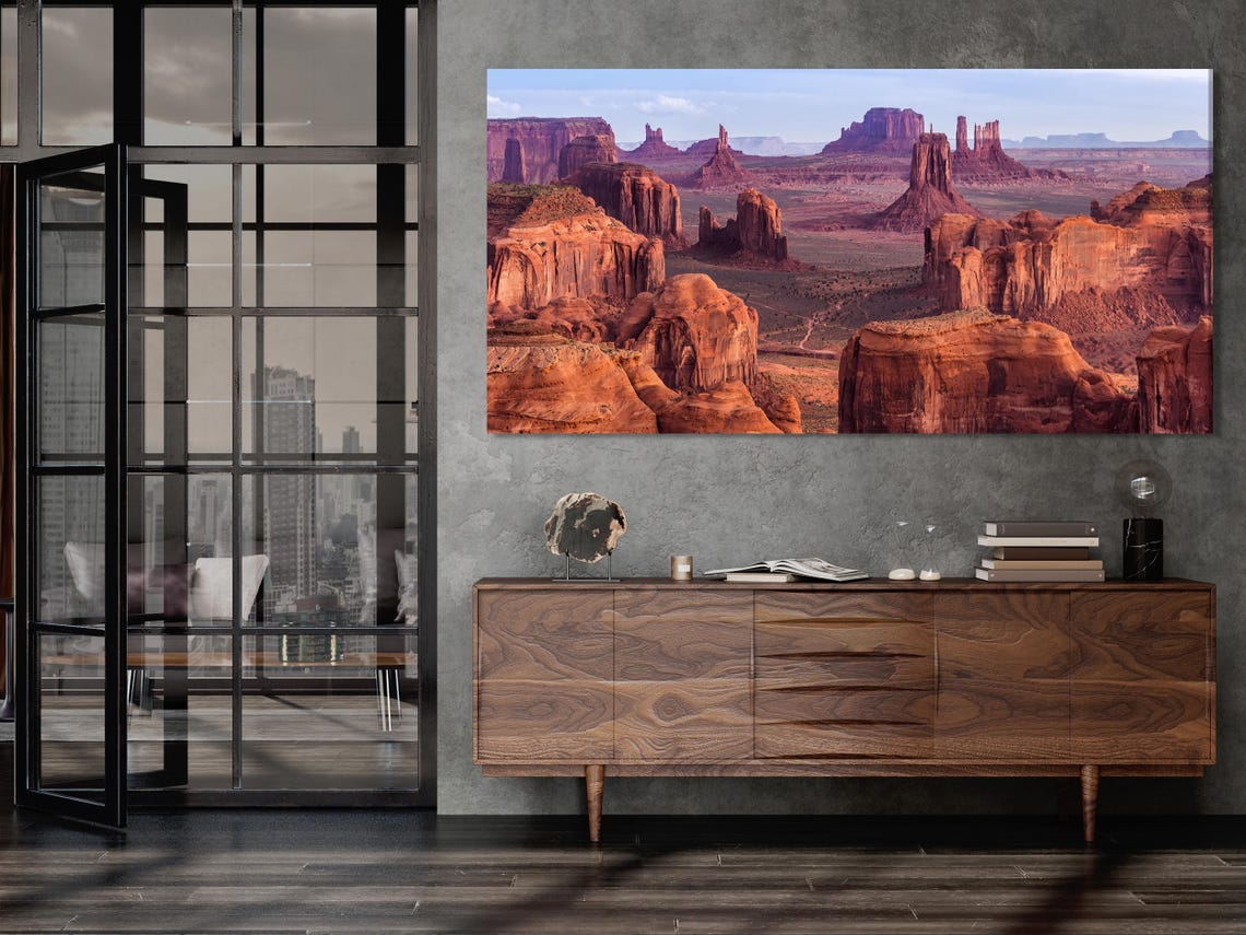 Desert canyon with red rock formations and pale blue sky detail view