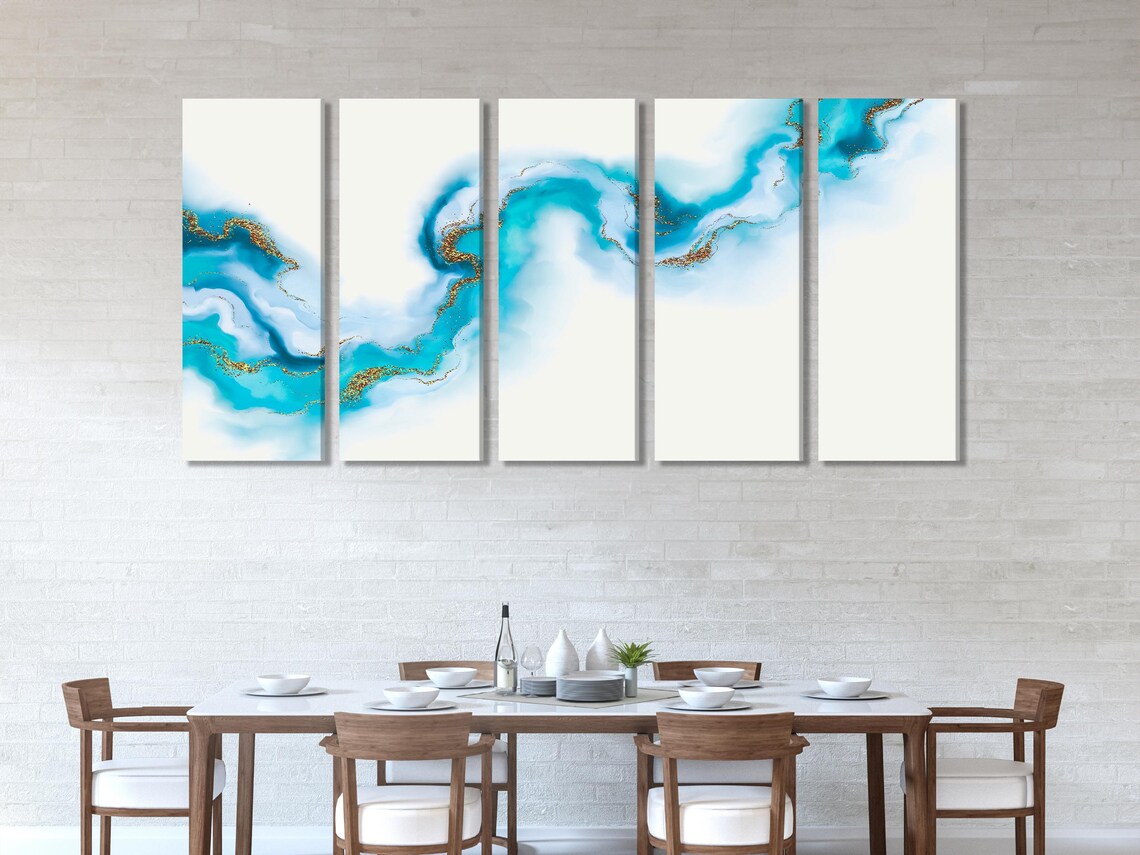 Living room mockup with three abstract blue-and-gold artworks above a sofa
