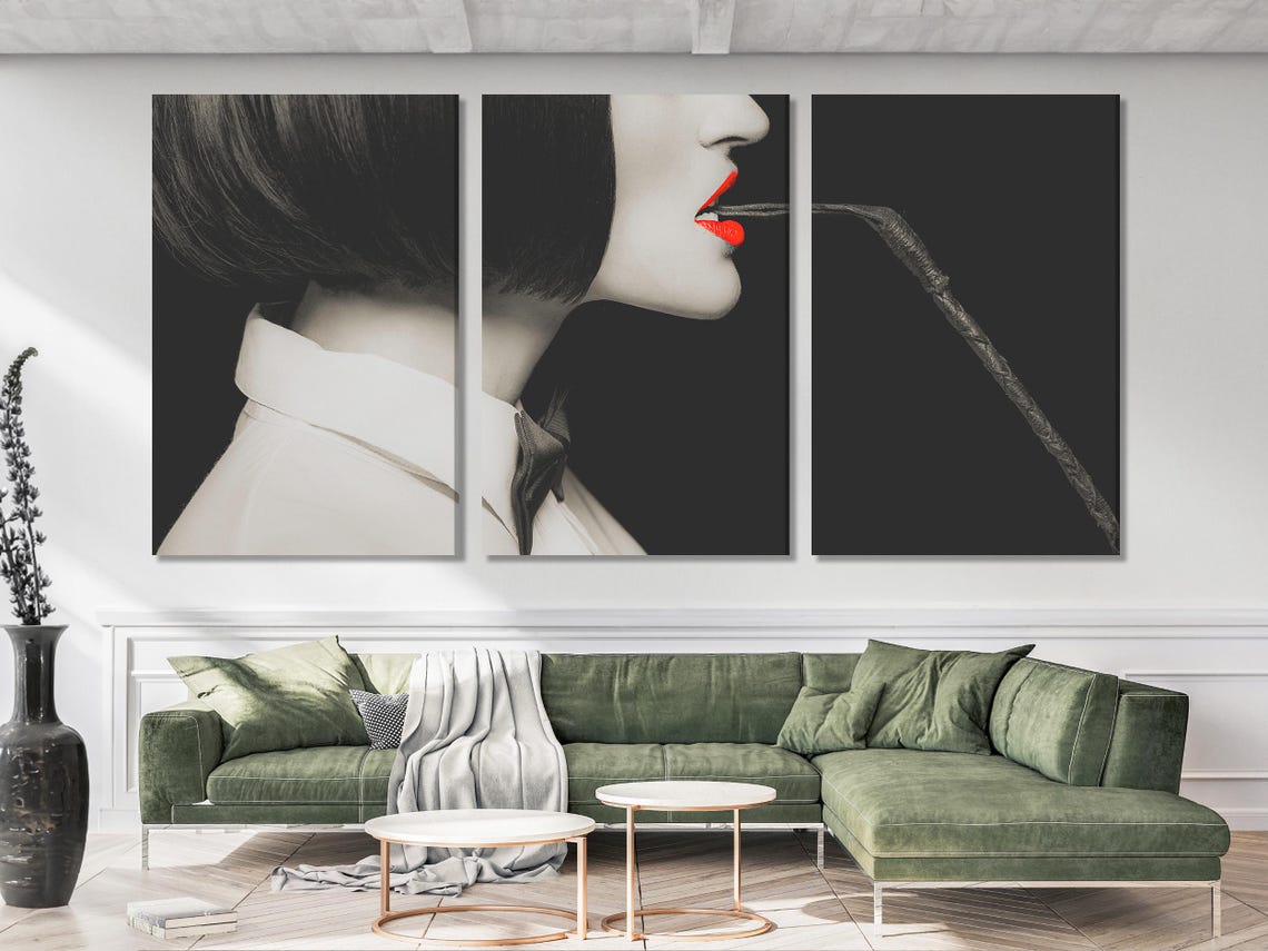Black-and-white side-profile portrait with vivid red lips and a dark whip-like curve detail view
