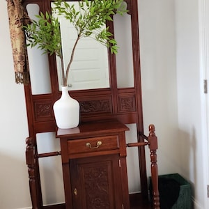 Antique hall tree with mirror for entry way.