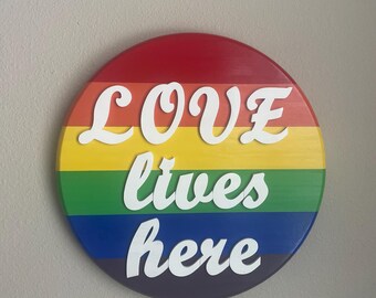 Love Lives Here | Rainbow Pride Flag Themed 14” Round Wall Hanging