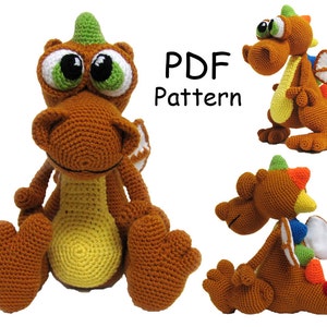 May include: Crochet pattern PDF for a brown and yellow dragon with green horns, white wings, and colorful accents. The PDF pattern includes instructions for making a crocheted dragon toy.