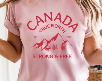 カナダシャツ、カナダデーTシャツ、カナダアパレル、True North Strong Canadian MountainグラフィックTシャツ。女性、旅行者、地元に誇りを持つ人へのギフト