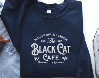 Black Cat Cafe Halloween Sweatshirt, Halloween Coffee Sweatshirt, Cozy Spooky Season Crewneck, Witchy Cat Lover Gift, Cute Halloween Shirt