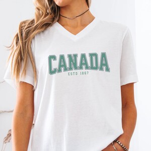 Canada Women's V-Neck Tee, Patriotic Graphic Tee, Canadian Pride Shirt, Vintage Canada T-Shirt, Canadian Travel Attire, Tourist Souvenir