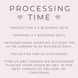 May include: A light pink informational graphic with dark gray text that reads PROCESSING TIME with two small hearts. It lists production and shipping timelines, international shipping details, duty information for US customers, and a holiday deadline.