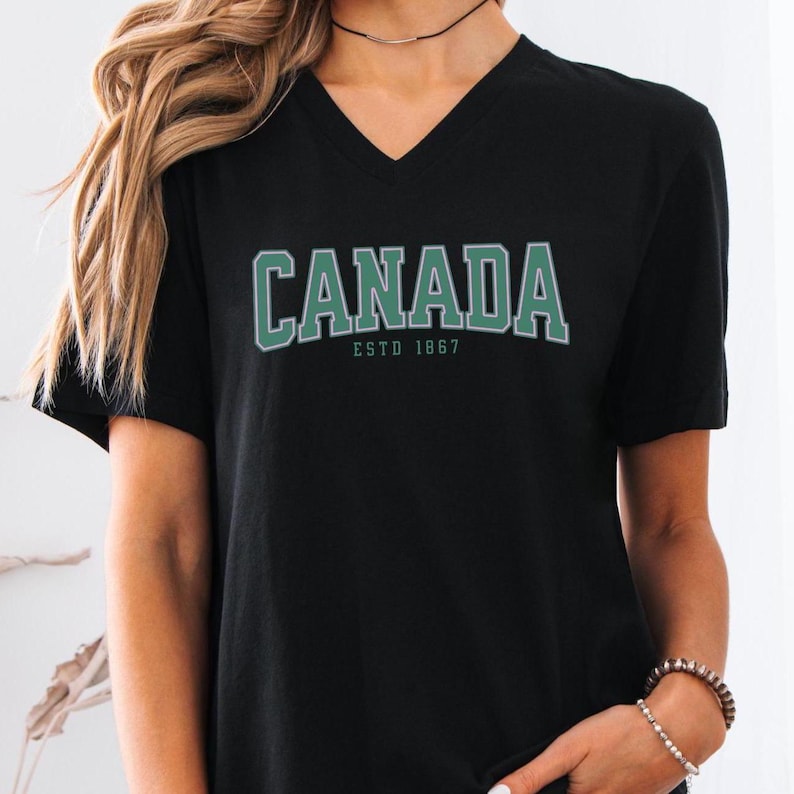 Canada Women's V-Neck Tee, Patriotic Graphic Tee, Canadian Pride Shirt, Vintage Canada T-Shirt, Canadian Travel Attire, Tourist Souvenir