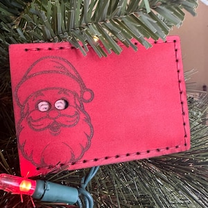 Cartera con identificación de Papá Noel