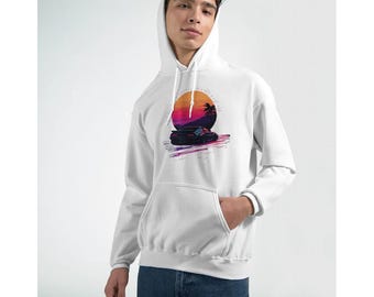 May include: White hooded sweatshirt with a front pocket and a graphic design. The design features a sunset with a palm tree and a car in shades of purple, orange, and pink.