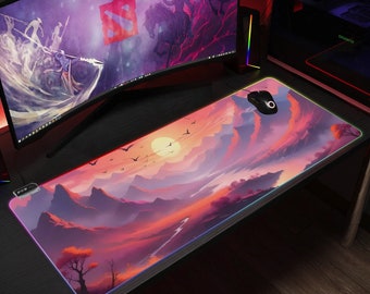 May include: A large purple and pink gaming mouse mat with a colourful sunset landscape and a black mouse on top. The mouse mat has a rainbow-coloured border.