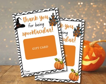 May include: Two printable Halloween gift card templates with black and white borders. The top template features a witch's hat, a haunted house, and the text "thank you for being spooktacular!" The bottom template features a pumpkin and the text "thank you for being spectacular!"
