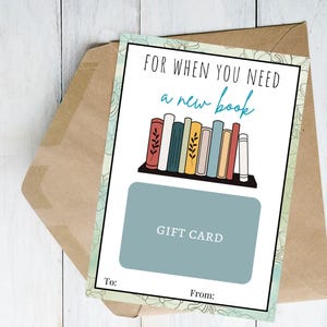 May include: A rectangular gift card holder featuring the text FOR WHEN YOU NEED a new book above an illustration of a bookshelf with colorful books. A solid blue rectangle labeled GIFT CARD sits below the books, with To and From lines at the bottom.
