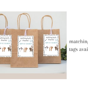 May include: Three brown paper gift bags with white tags. The tags read "Nothing butt, thanks! Happy Vet Tech Week!" and feature cartoon animal rear ends. The bags have tan handles.