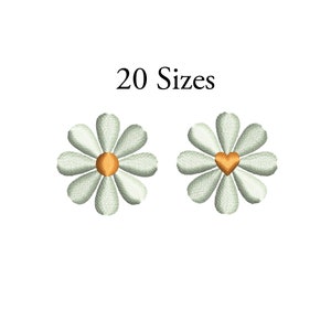 Puede incluir: Dos diseños de margarita bordados, uno con un centro amarillo y el otro con un centro de corazón dorado. 20 tamaños.