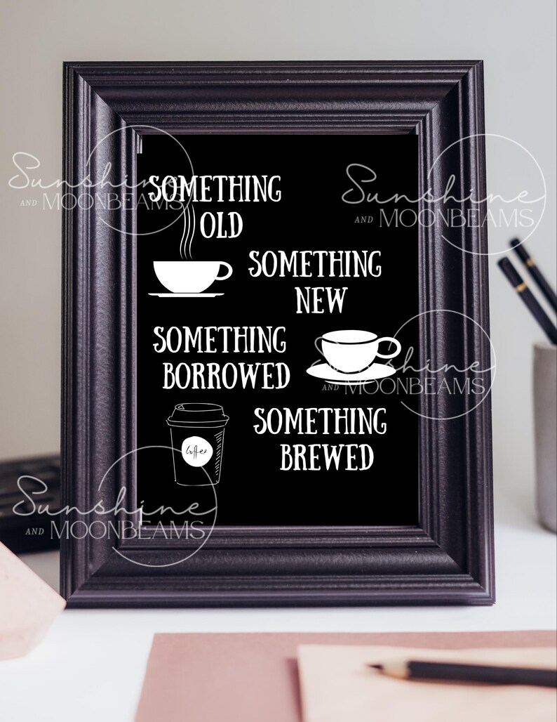 May include: A black framed chalkboard sign with white text and illustrations of coffee cups and a coffee to-go cup. The text reads "Something Old, Something New, Something Borrowed, Something Brewed".
