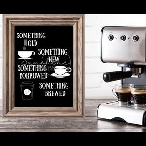 May include: A framed chalkboard sign with the text "Something Old, Something New, Something Borrowed, Something Brewed" with coffee cup illustrations. The sign is sitting on a wooden surface next to a silver espresso machine with two cups of coffee.