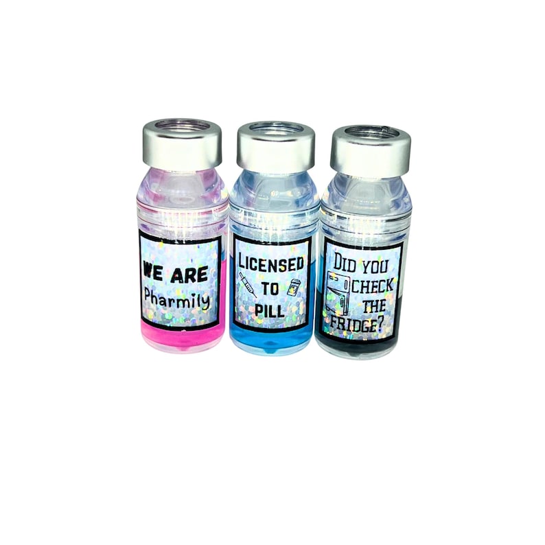 three different liquid vial caps. pink liquid vial cap says we are pharmily, blue liquid vial cap says licensed to pill, gray liquid  vial cap says "did you check the fridge?"