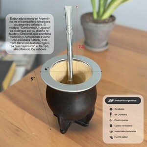 May include: A dark brown natural gourd mate cup with a silver-colored metal rim and four feet, accompanied by a silver-colored metal bombilla straw. The cup features a 4-inch diameter and a 5-inch height, with the bombilla measuring 7.5 inches long.