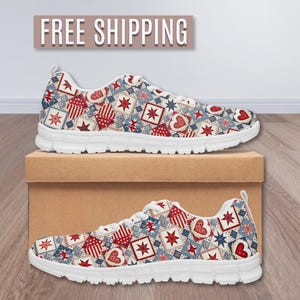 May include: Pair of patterned sneakers with a white sole. The sneakers feature a repeating design of red hearts, stars, and geometric shapes on a blue and cream background. The text "FREE SHIPPING" is above the shoes.