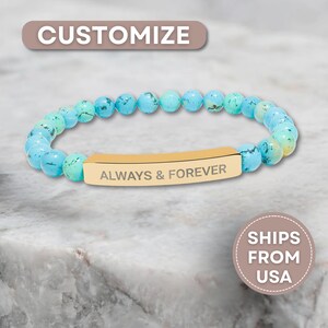 May include: A beaded bracelet with turquoise and blue beads. The bracelet features a gold-colored bar engraved with the words "ALWAYS & FOREVER". The word "CUSTOMIZE" is in the top left corner.